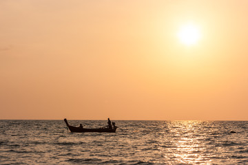 Traditional thai long tail boat at sunset, Long Beach, Ko Lanta, Thailand.