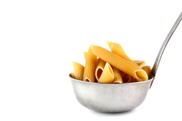 Penne pasta in a metal bucket on a white background. Isolate