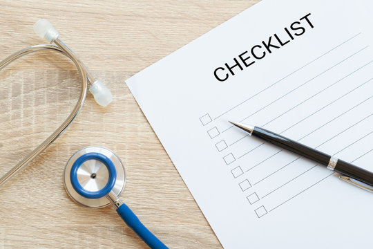 Hands Writing Checklist With Annual Health And Stethoscope - To Do List, Goal