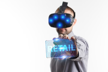 Business, Technology, Internet and network concept. Young businessman working in virtual reality glasses sees the inscription: Retail