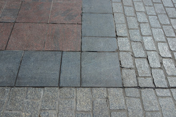 surface with multicolored plates and paving stones