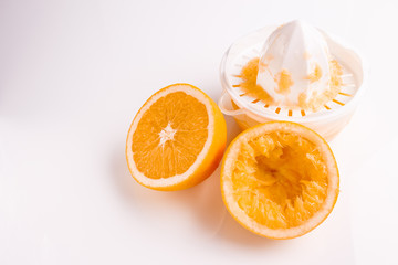 oranges and juice on a white background