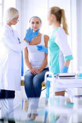 Obraz premium Beautiful woman face near doctor with syringe