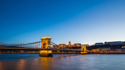 Naklejka premium Budapest, Hungary - Skyline of Budapest with Szechenyi Chain Bridge and Buda Castle Royal Palace at blue hour and clear blue sky