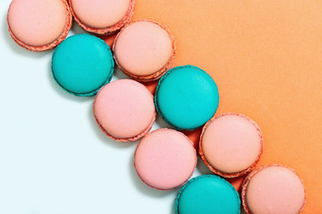 Sweet colorful macaroons. Row of mint and pink macarons. Top view. Copy space. Pastel colors.