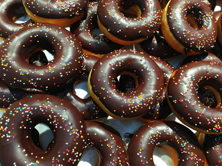 Donuts in colored glazes on a dark background.Pastries,dessert.selective focus