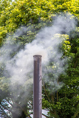 Fototapeta na wymiar Smoking chimney stack