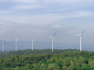 Group of Wind turbines generating electricity with blue sky, Energy Production with clean and Renewable Energy, energy conservation concept