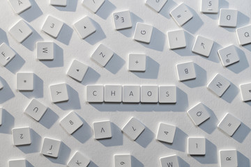 description of the word Chaos with the letters of an old keyboard