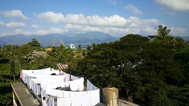 Laundry on rooftop with Puerto Princesa port in background