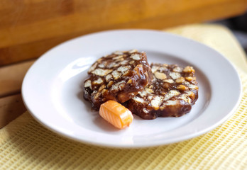 Home sherbet and caramel candy lie on a plate