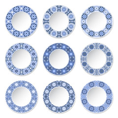 Set of decorative plates with a circular blue pattern, top view. White background. Vector illustration.