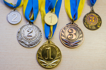 Gold, silver and bronze sports medals.