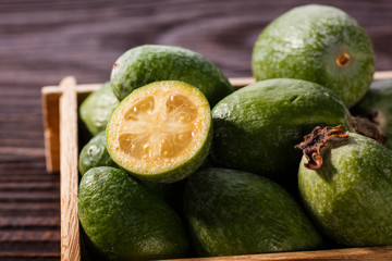 fresh fruits of the feijoa on the rustic background
