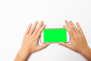 Young woman hold green screen mobile.