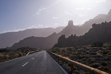 The dangerous turned road in the rocky mountains during early morning light