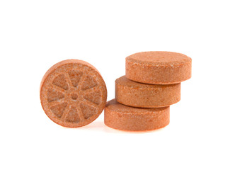 vitamin c in tablets on white background