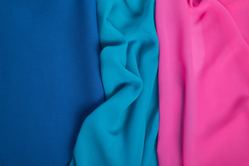 bright draped background of multi-colored chiffon fabric