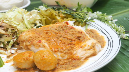Thai food set is Rice vermicelli with fish curry sauce and vegetable close up