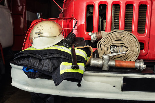 Firemen gear on firetruck such as fire barrel, special clothing, ration, helmet and lamp