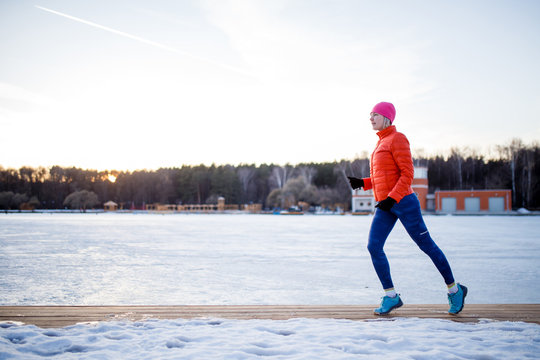 Photo of sports girl on morning exercise in winter
