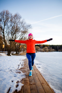 Image of young athlete girl on morning exercise in winter