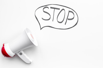Demand to stop concept. Megaphone near cloud with word stop on white background top view space for text