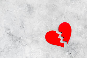 Divorce concept. Sign of divorce. Broken heart on grey background top view copy space