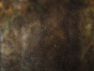 Tiny dust particles in a sunlight on a dark natural background.  Abstract lighting