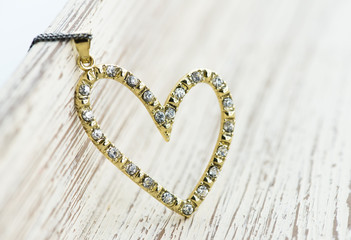 heart shaped pendant on pink background