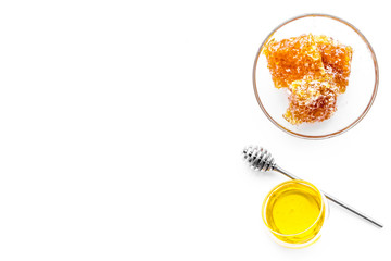 Honeycomb filled with honey on plate on white background top view space for text
