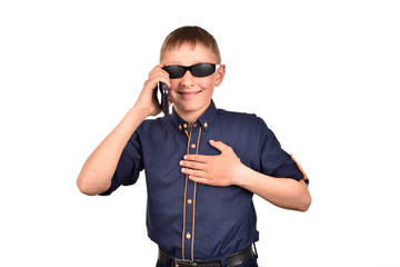 A successful young man with a mobile phone. A boy wearing glasses on a white background.