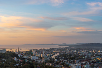 Fototapeta na wymiar DUONG DONG, PHU QUOC, VIETNAM - NOVEMBER 21, 2017: Beautiful view from the high on town, sea, bay and hills at sunset