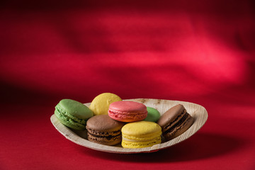 Wooden dish with assorted macarons