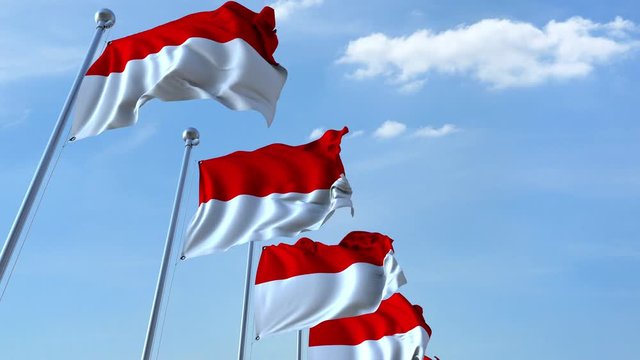 Waving flags of Indonesia against the sky, loopable 3D animation