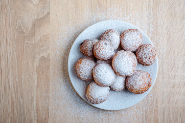 Curd cheese doughnuts on wooden background. Top view.