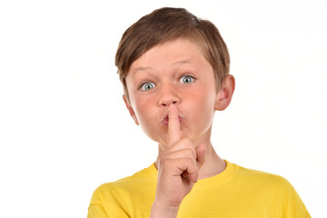 Portrait of a boy on a white background. Emotional child. Studio pictures of a teenager. © OLEKSANDR