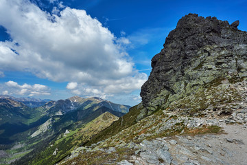Obraz premium Rocky peaks and clouded sky in the Tatra Mountains in Poland.