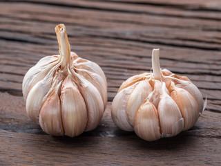 Garlic bulbs on the wooden table.
