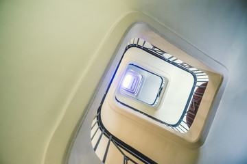 A huge spiral staircase, view from below.