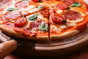 classic Italian pizza on a wooden tray, served in a small authentic Italian restaurant