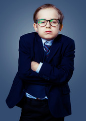 hansome boy wearing glasses and a black suit