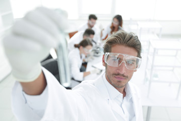 Fototapeta premium tube with reagents on blurred background laboratory.