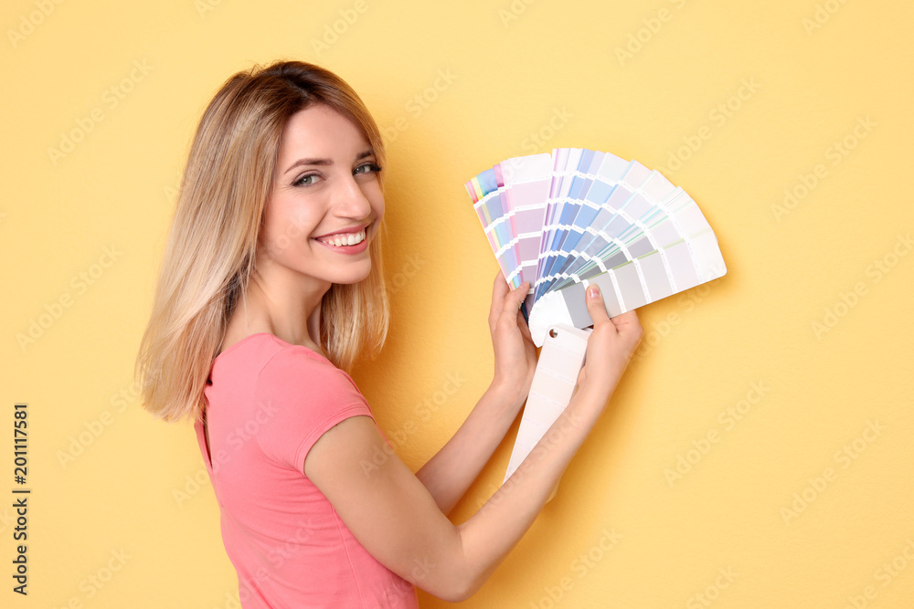 Poster Young woman with color palette on yellow background