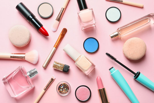 Flat lay composition with decorative cosmetics on color background