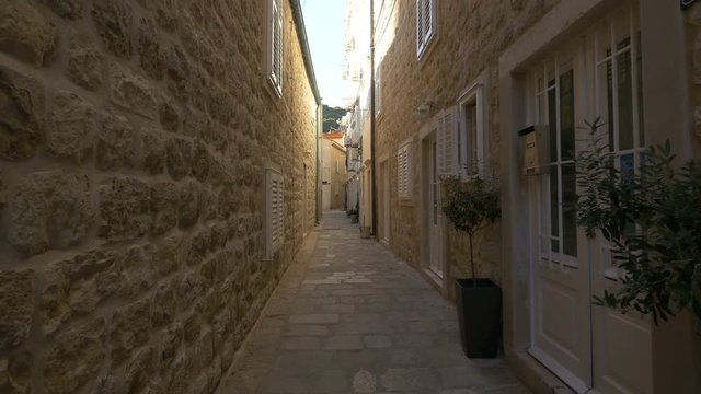 Narrow street between stone buildings