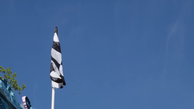 Finishing checkered flag on blue background.