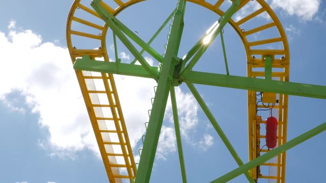 Roller coaster at amusement park. View from the bottom of the rails.