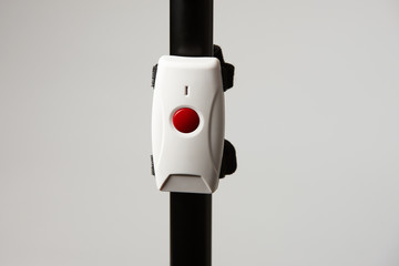 Emergency call button on a white background, close-up