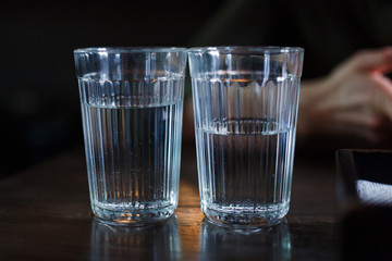 Two glasses with vodka on a table in a restaurant